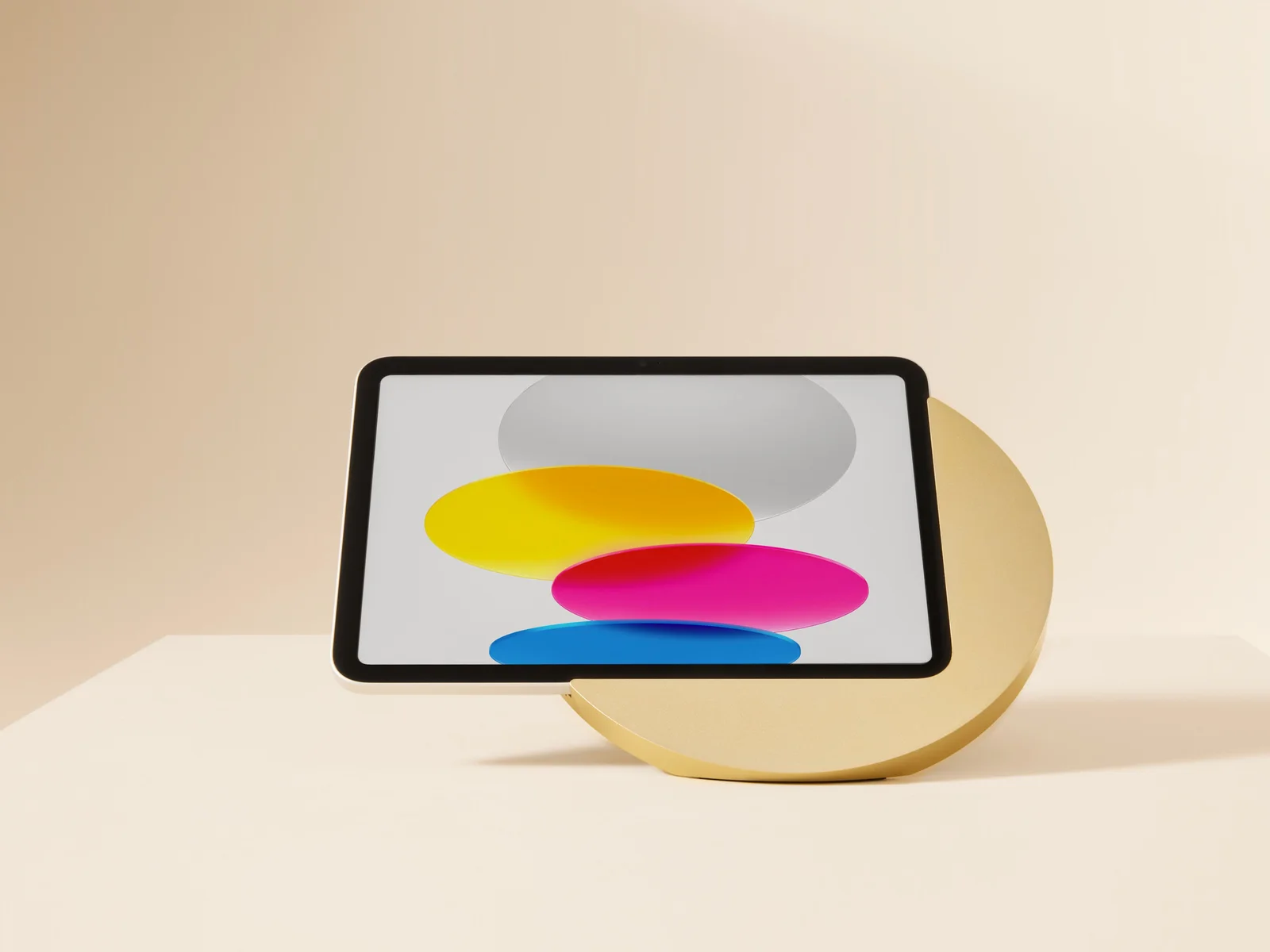Displine Sunset Stand in gold, holding an iPad on a rod leg