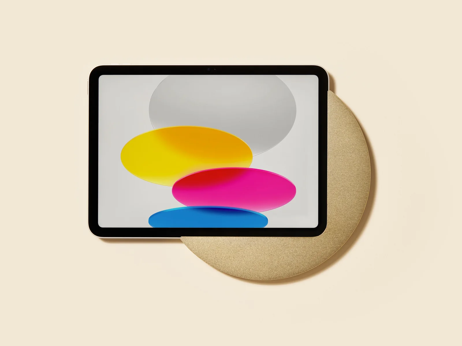 Displine Sunset Wall, a round gold mount holding an iPad