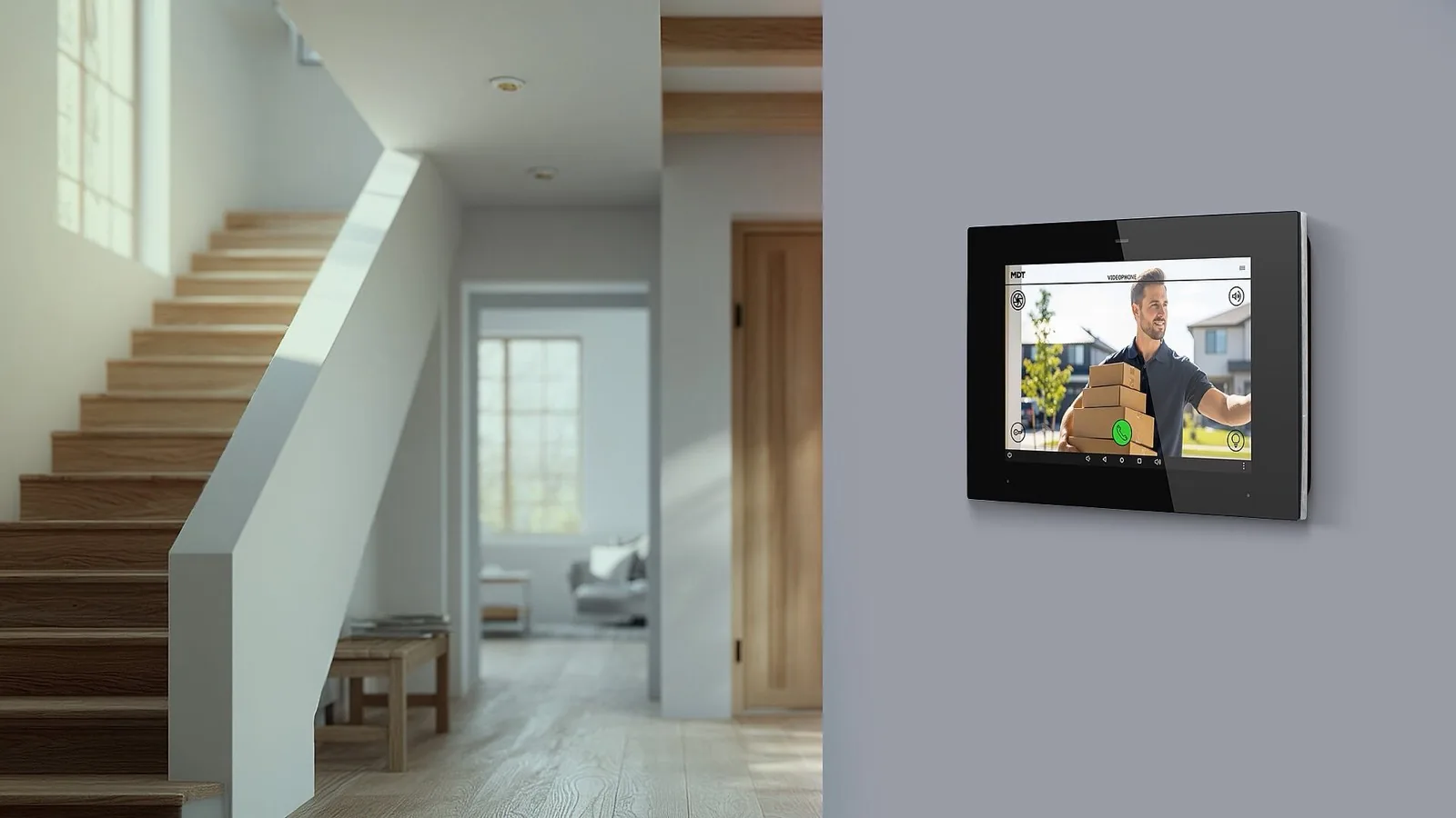 MDT VisuControl touch panel on a wall beside a staircase