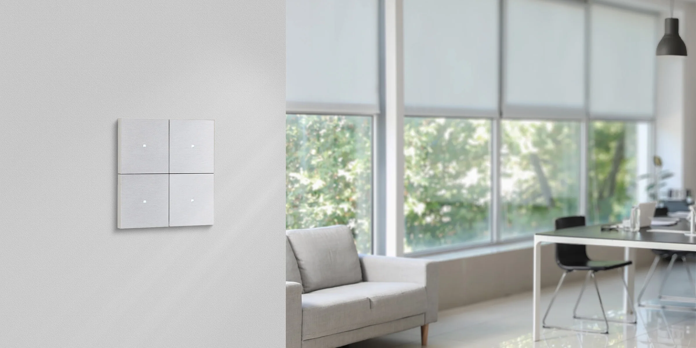 An aluminium four-button Tense Intensity on a light wall, a bright living space behind